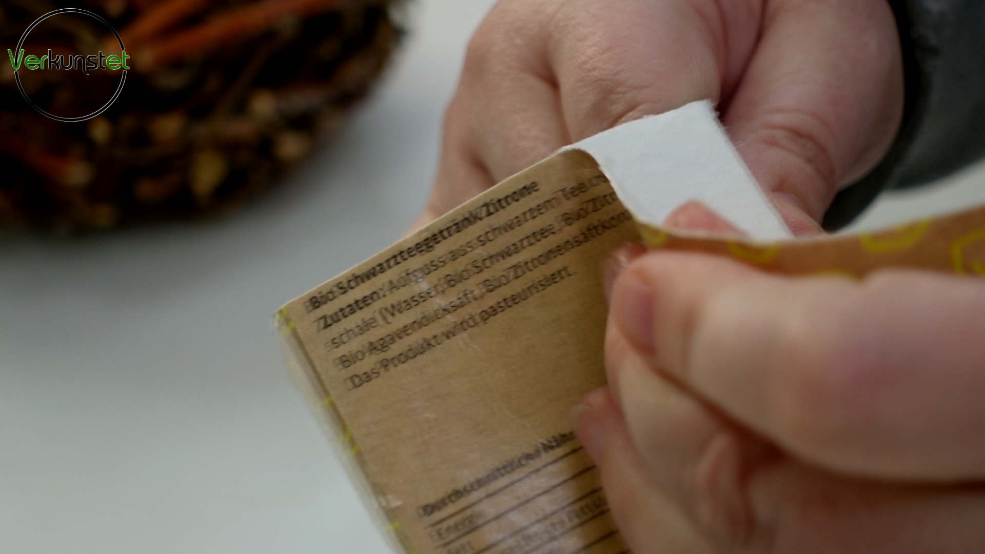 Close-up of how to remove the foil from the milk carton